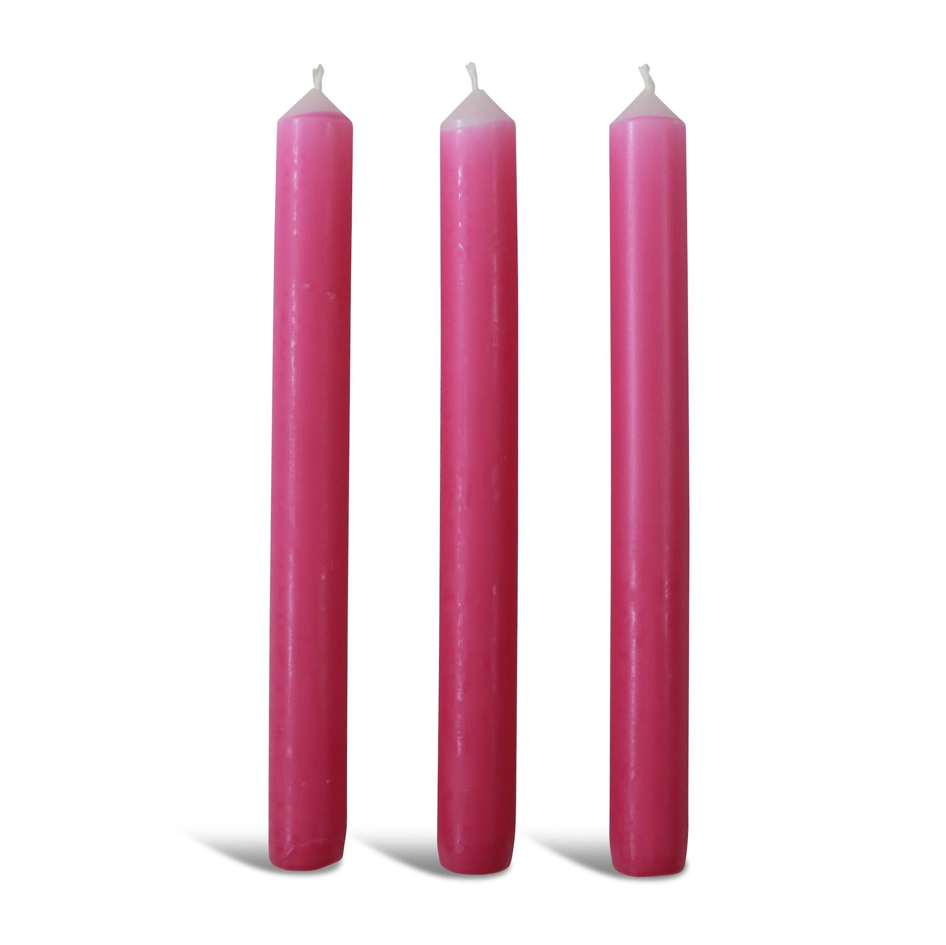 Three pink dinner candles