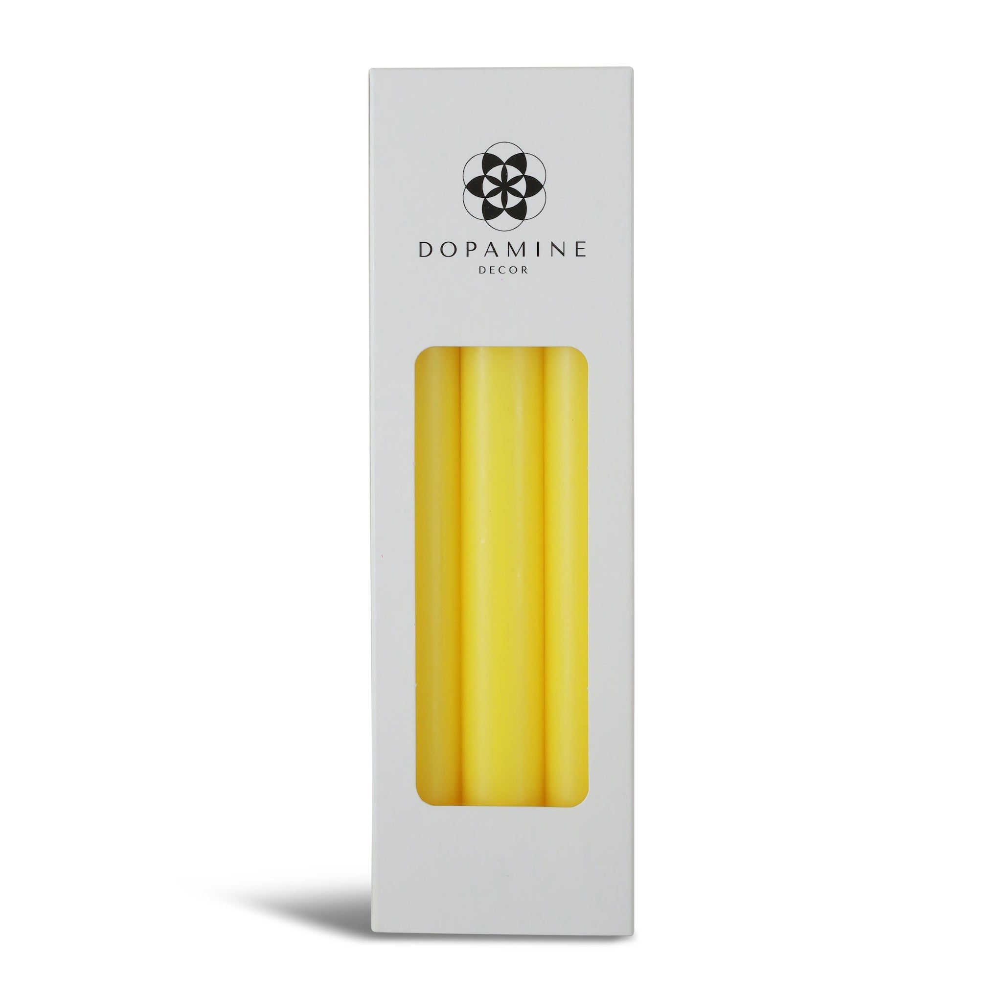 Three yellow dinner candles in a box